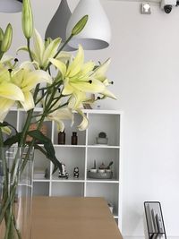 White flower vase on table at home