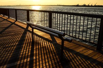 View of railing against calm sea