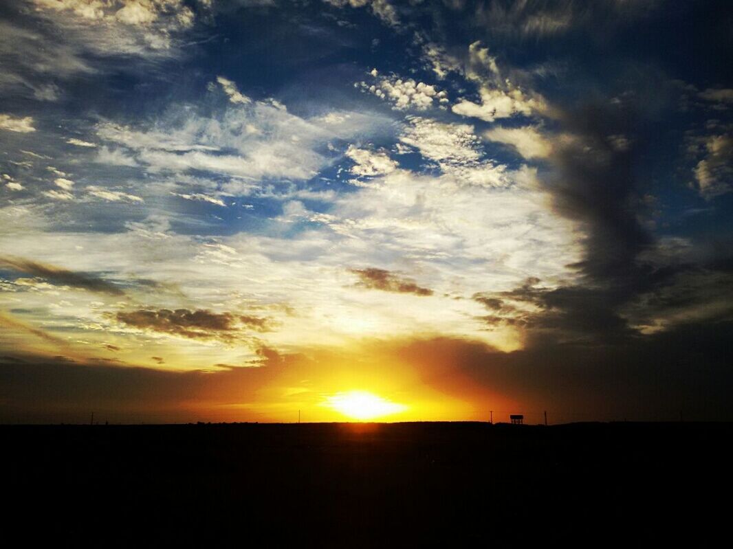 sunset, sun, silhouette, sky, scenics, tranquil scene, beauty in nature, tranquility, orange color, landscape, cloud - sky, idyllic, nature, sunlight, cloud, sunbeam, field, dramatic sky, horizon over land, moody sky