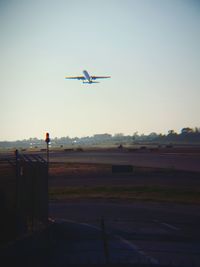 Airplane flying over landscape