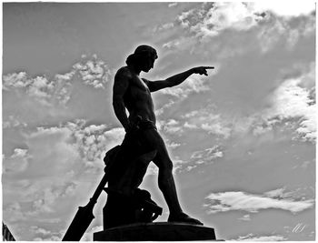 Low angle view of statue against sky