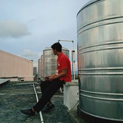 Low angle view of man standing in factory