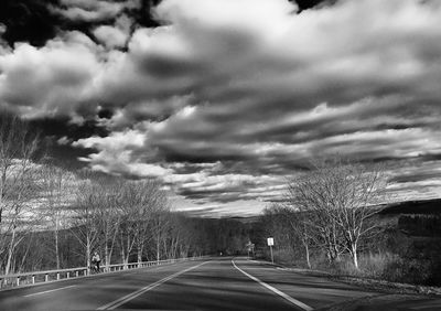 Road against cloudy sky