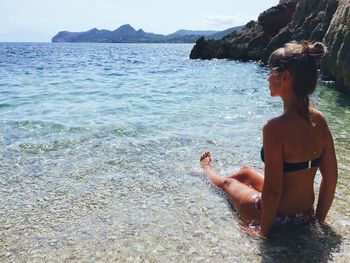 Woman sitting on beach