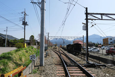 Train on railroad track against sky