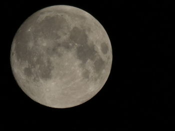 Low angle view of moon against sky at night