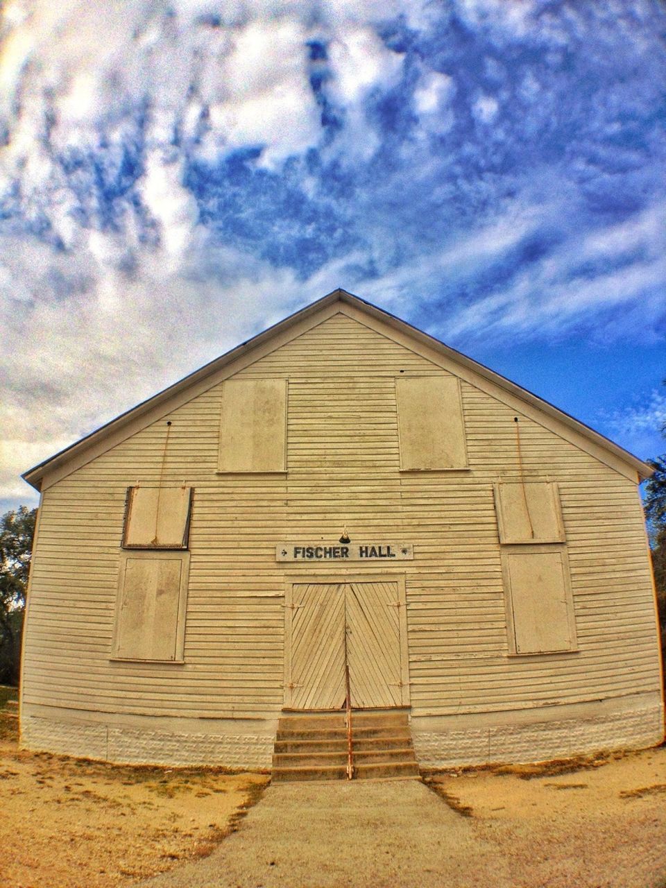 architecture, built structure, building exterior, sky, cloud - sky, low angle view, cloudy, cloud, house, outdoors, day, no people, residential structure, building, exterior, brick wall, old, wall - building feature, sunlight, window