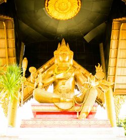 Low angle view of statue against building