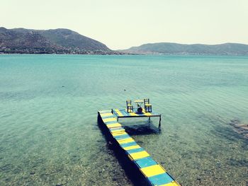 Boats moored in sea
