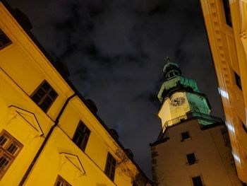 Low angle view of illuminated building against sky
