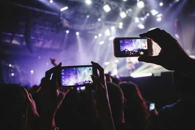 Woman playing guitar in music concert