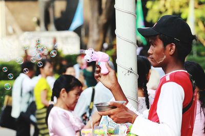 Group of people having food outdoors