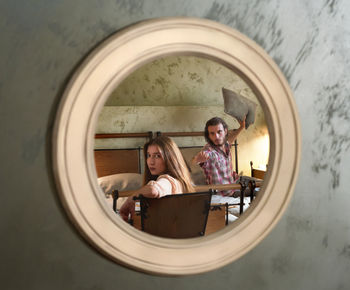 Reflection of couple on circular mirror