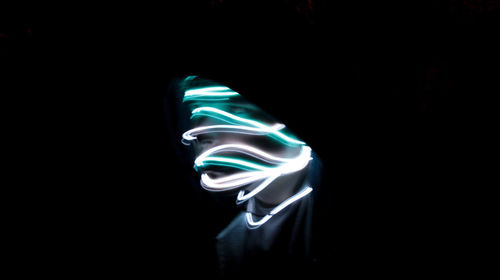 Close-up of abstract lights over black background