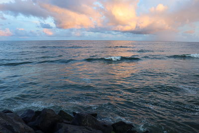 Scenic view of sea against sky during sunset