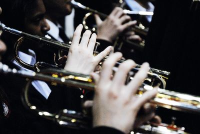 Cropped image of musician playing trumpets