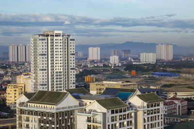 Buildings in city against sky