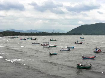 Boats on sea against sky