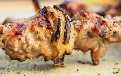 Close-up of meat on barbecue grill