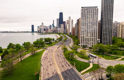 High angle view of street amidst buildings against sky