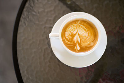 High angle view of cappuccino on table