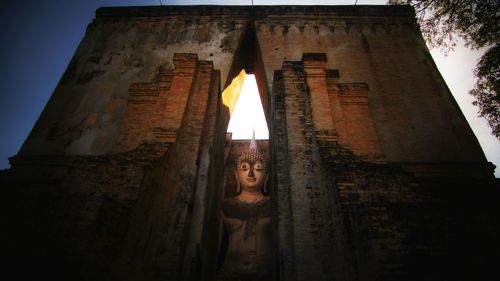 Low angle view of buddha statue at wat si chum