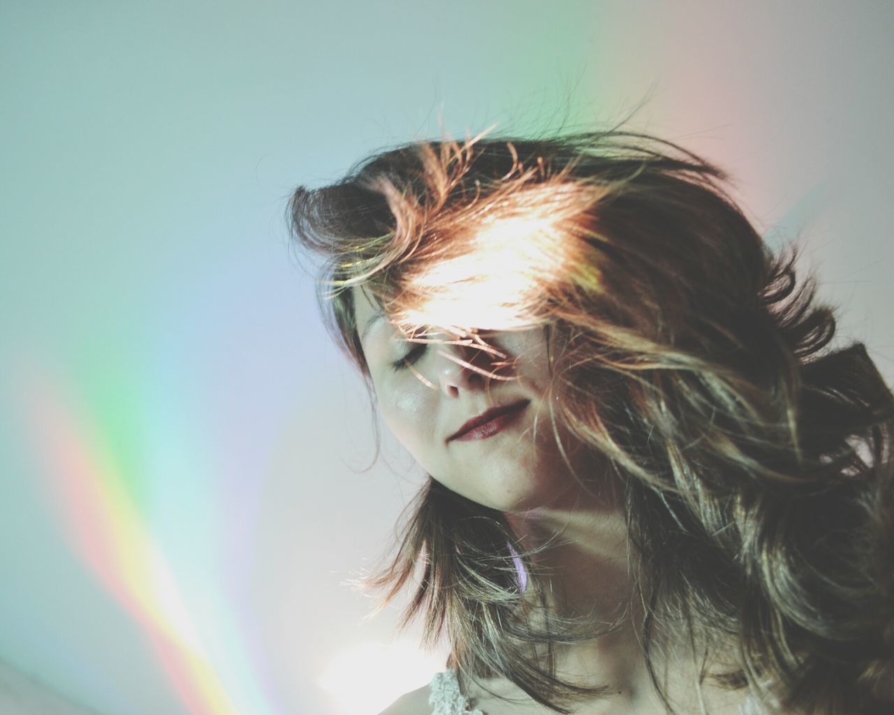 headshot, lifestyles, close-up, leisure activity, young women, person, young adult, long hair, head and shoulders, focus on foreground, front view, human face, human hair, portrait, sky, looking at camera, sunlight, brown hair