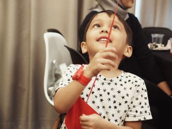 Close-up of boy playing at home