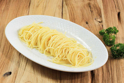 High angle view of noodles in plate on table