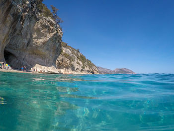 Scenic view of sea against clear blue sky