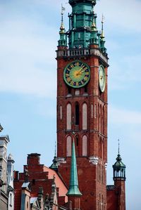 Low angle view of clock tower against sky