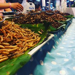 High angle view of fired insects for sale in market