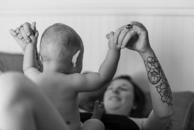 Portrait of smiling boy with arms raised