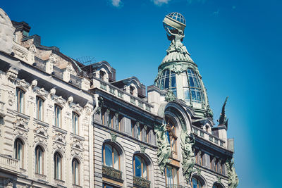 Low angle view of historical building against blue sky