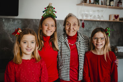 Christmas portrait of grandmother with granddaughters