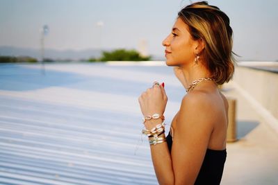 Young woman looking at swimming pool