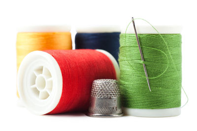 Close-up of thread spools on table