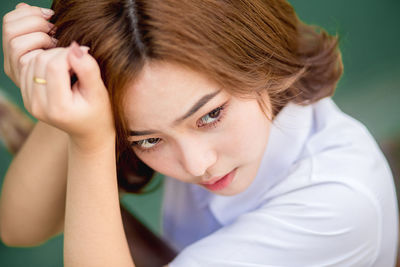 Close-up of thoughtful young woman looking away