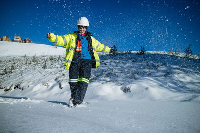 Photography of young woman having fun with snow