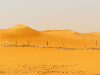 Scenic view of desert against clear sky