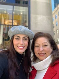 A big smile walking through the rockefeller center in new york