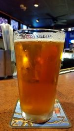 Close-up of beer glass on table