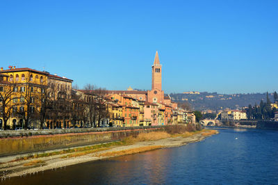 View of cathedral in city against clear blue sky