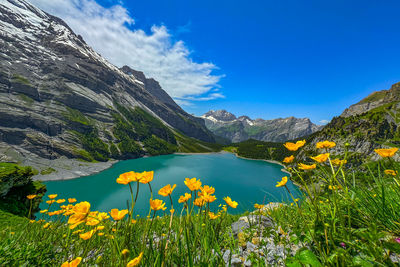 Scenic view of mountains against blue sky