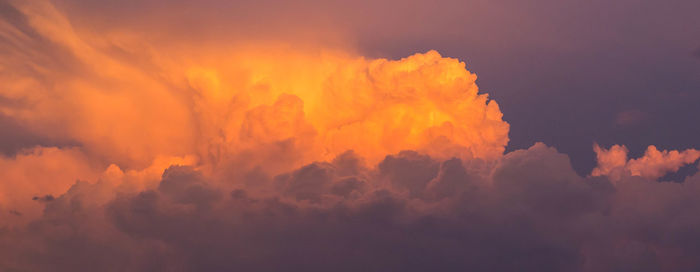 Low angle view of cloudy sky at sunset