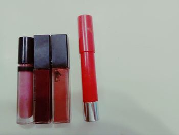 Close-up of colored pencils over white background