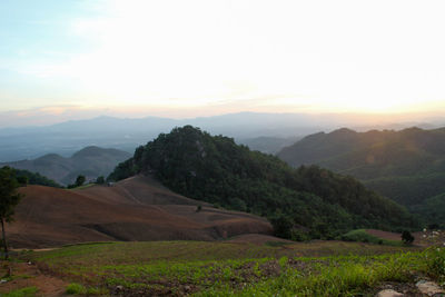 Scenic view of mountains against sky during sunset