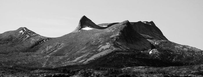 Low angle view of rock formations against sky