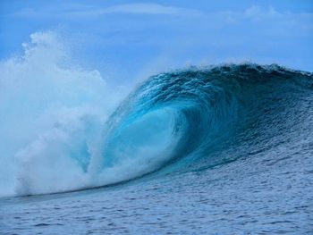 Scenic view of sea waves against sky