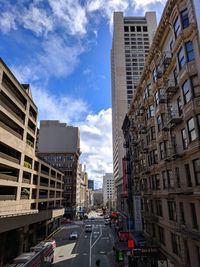 City street amidst buildings against sky